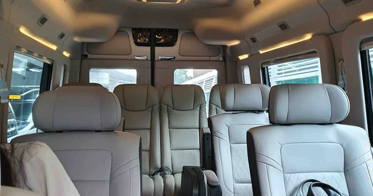 Rows of leather seats inside a private van for the drive from Incheon Airport to Gangnam